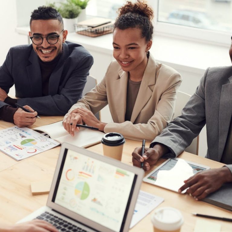 a group of people sitting around a table