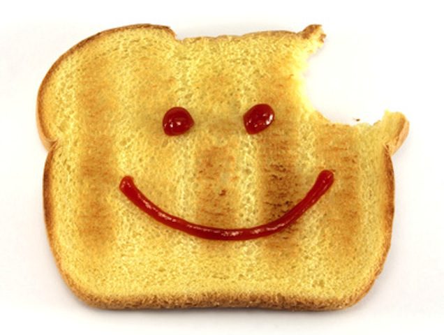 a piece of toast with a face drawn on it