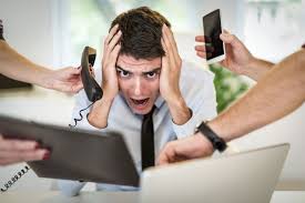 Three Proven Ways to Staying Focused on Your Goals 26 a man holding his head in his hands