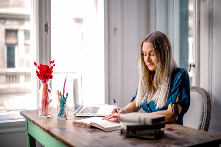 woman sitting at the table working