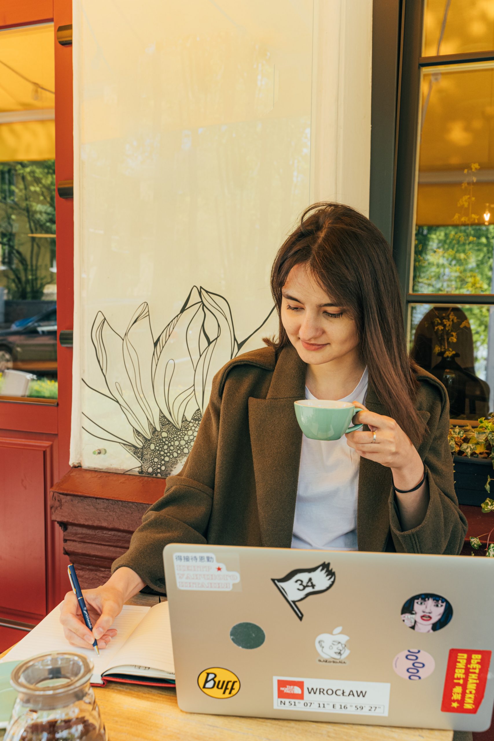 woman-writing-on-a-notebook