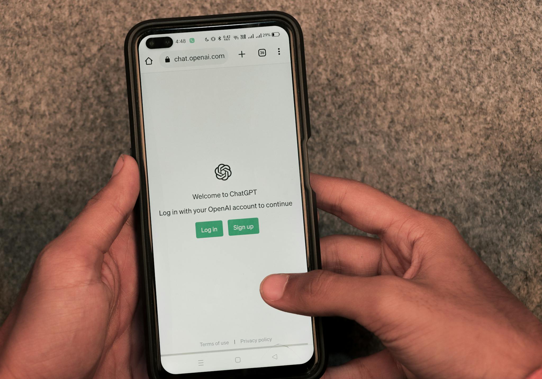 close up of hands using smartphone with chatgpt